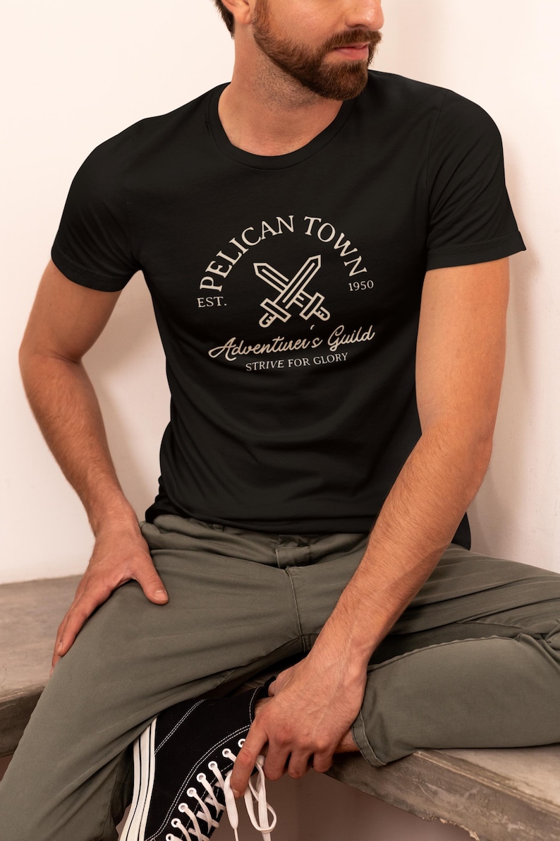 Stardew Valley Shirt | Pelican Town Adventurers Guild Tee | Retro Gaming Gift | Cozy Gamer Tee | Stardew Valley Fan Gift Bild 1