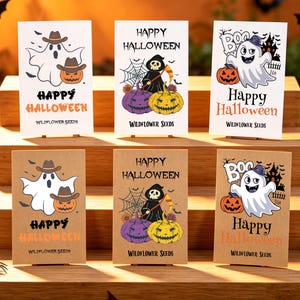 May include: Six rectangular seed packets arranged in two rows, featuring white and kraft paper backgrounds. Each packet displays Halloween-themed illustrations of ghosts, pumpkins, and skeletons with the text Happy Halloween and Wildflower Seeds.