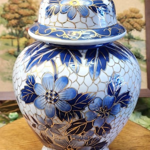 May include: A handmade wooden sign with the text "Welcome to our home" in a handwritten style. The sign is painted white with black lettering and a distressed finish, perfect for home decor.