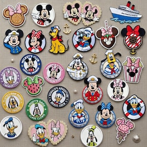 May include: A selection of vibrant Disney character patches, featuring Mickey Mouse, Minnie Mouse, Donald Duck, and Pluto. The patches showcase diverse designs, including nautical themes, character portraits, and text such as "Mickey's Club".
