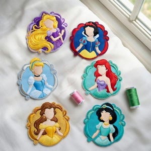 May include: Embroidered patches featuring Disney princesses, including Rapunzel, Snow White, Cinderella, Ariel, Belle, and Jasmine. Each patch has a detailed design with vibrant colors and a decorative border. The patches are on a white surface.