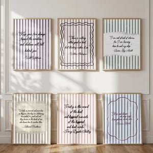 May include: Six framed wall art prints featuring literary quotes on striped backgrounds. The prints include text by Walt Whitman, William Shakespeare, Louisa May Alcott, Nathaniel Hawthorne, Percy Bysshe Shelley, and Herman Melville in various frames.