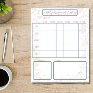 May include: A floral-themed weekly assignment tracker with a light pink header that reads "Weekly Assignment Tracker". The planner has spaces for each day of the week and periods. A notebook, pen, and coffee cup are also visible.