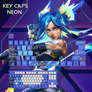 May include: Blue and white keyboard keycaps with a neon design. The keycaps feature a stylized illustration of a character with blue hair. The text "KEY CAPS NEON" is displayed at the top. The keyboard keys are blue and white.