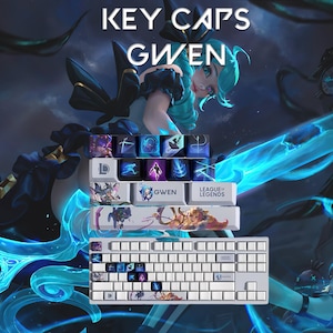 May include: White keyboard with custom keycaps featuring the character Gwen from League of Legends. The keycaps have various designs and the text "KEY CAPS GWEN" is at the top.