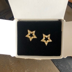 New Vintage Avon  Gold Sparkle Star Earrings Featuring Crystal Clear Rhinestones and Surgical Steel Posts ~ In The Original Box Dated 1994