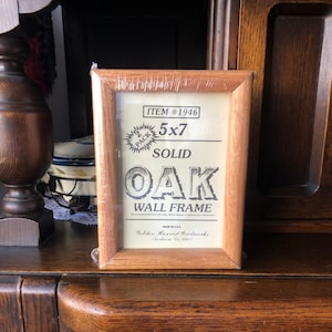 May include: A 2-pack of 5x7 inch solid oak wall frames. The frames are made in the USA by Golden Harvest Woodworks, Sunbeam, CA 92073.