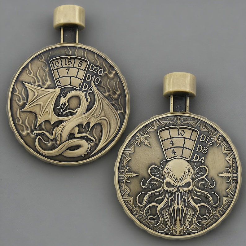 May include: Two bronze-coloured pendants with a loop at the top. One pendant features a dragon with dice numbers, the other has an octopus-like creature with dice numbers. The pendants are likely for role-playing games.