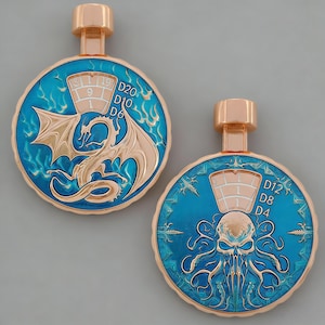 May include: Two rose gold pendants with a blue enamel background. One features a dragon design, the other a skull with tentacles. Both have dice numbers and a rose gold top.