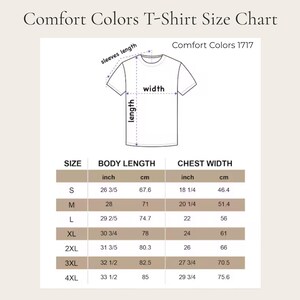 May include: A size chart for Comfort Colors T-shirts. The chart includes measurements for body length and chest width in inches and centimeters. Sizes range from S to 4XL. The chart also shows a diagram of a t-shirt with labeled measurements.