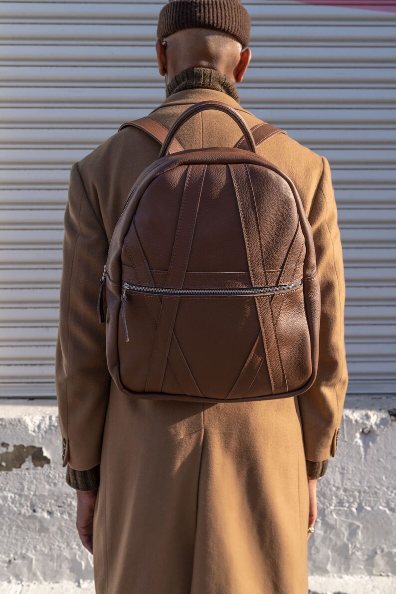 Lifestyle photo of brown leather work school backpack