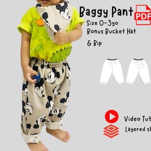 May include: A child's outfit featuring a lime green t-shirt with a dinosaur graphic, paired with beige baggy pants adorned with black Mickey Mouse prints. Includes a matching bib and bucket hat. The text reads "Baggy Pant" and "Size 0-3yo".