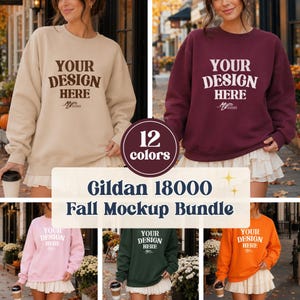 Puede incluir: Una colección de sudaderas de cuello redondo Gildan 18000 en beige, granate, rosa claro, verde oscuro y naranja. Cada sudadera presenta el texto 'YOUR DESIGN HERE' en una fuente serif negrita, con un pequeño logotipo debajo del texto.