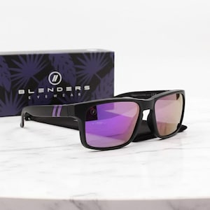 May include: Black sunglasses with purple mirrored lenses and a black frame. The sunglasses have a square shape and feature two purple stripes on the temple. The sunglasses are displayed with a box that has the text "BLENDERS EYEWEAR".