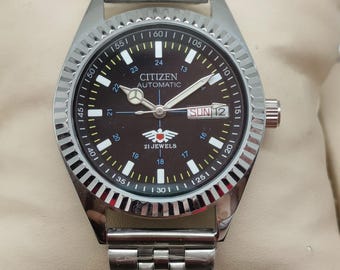 Reloj Citizen automático vintage: 21 joyas, esfera negra, fecha y día, brazalete de acero inoxidable de 24 horas.