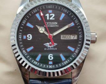 Vintage Citizen Automatic Watch: Black Textured Dial, Blue Accents, Leather Strap
