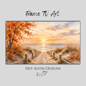 May include: A digital print titled Frame TV Art by Hey Alvin Designs featuring a watercolour landscape of a sandy path leading to the ocean at sunset, framed by autumn trees with orange leaves and tall grass, with a small dog icon below.