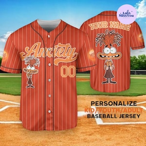May include: Orange baseball jersey with white pinstripes, featuring the word "Anxiety" and a cartoon character. The jersey also has the number "00" and the text "Your Name" on the back. The bottom of the jersey reads "Personalize Kid/Youth/Adult Baseball Jersey."