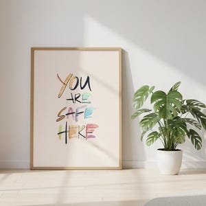 You Are Safe Here Wall Art Print | LGBTQ Pride Quote Poster | Includes Rainbow Typography | Queer Safe Space Decor