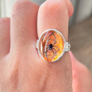 May include: A set of three ceramic mugs with a speckled, matte finish. The mugs are in shades of cream, light gray, and dark gray. Each mug has a simple, minimalist design and a rounded handle. Perfect for coffee or tea.