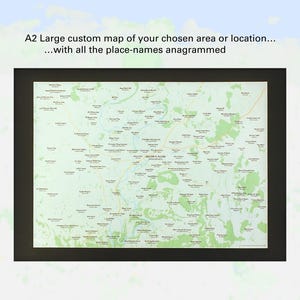 May include: A framed A2 custom map featuring a detailed geographical layout with numerous place names. The map is presented in a black frame, with the text "A2 Large custom map of your chosen area or location... with all the place-names anagrammed" at the top.