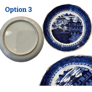 May include: Three blue and white ceramic plates. One plate is upside down, showing the unglazed bottom. The other two plates have a detailed landscape design with buildings and bridges. The plates have a scalloped edge and a blue border. The text "Option 3" is in the upper left corner.