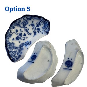 May include: Three antique white porcelain dishes with blue floral patterns and accents. One dish is a small, curved serving dish. The other two are curved, boat-shaped dishes with a blue emblem and text. The text "Option 5" is in the upper left corner.