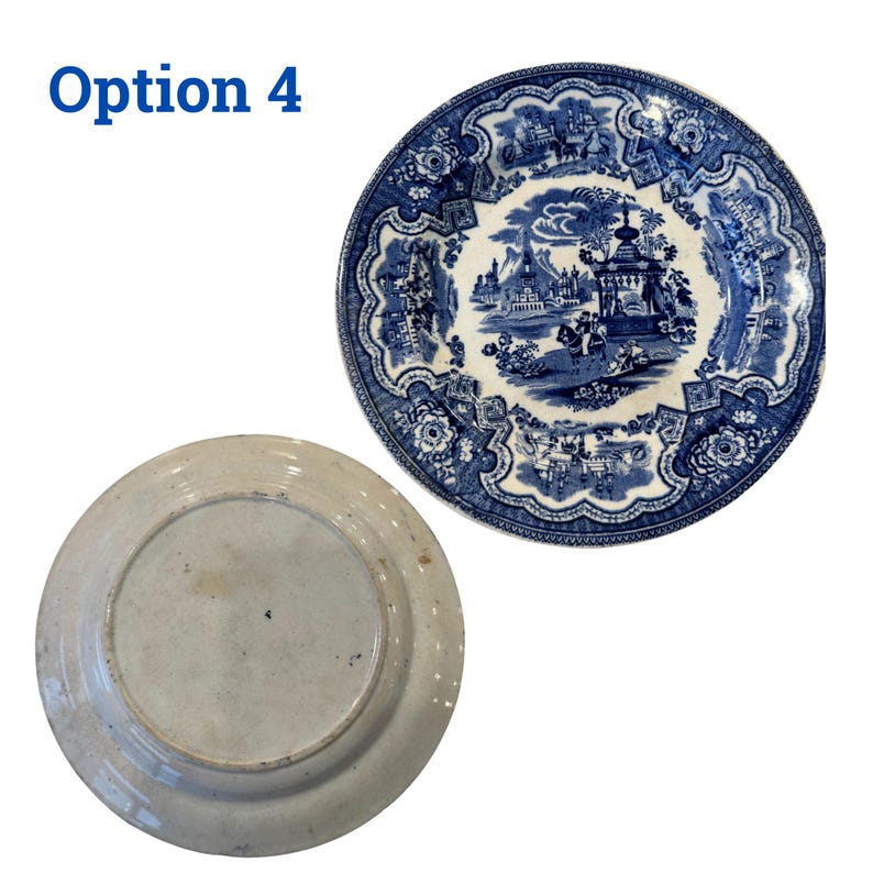 May include: Two antique blue and white ceramic plates. One plate features a detailed landscape scene with figures and buildings. The other plate shows the underside, with a light beige color and a central ring.