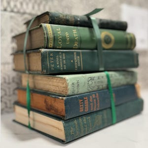 May include: A rustic wooden sign with the text "Welcome to our home" in white lettering. The sign features a distressed finish and a simple, inviting design, perfect for entryway decor.