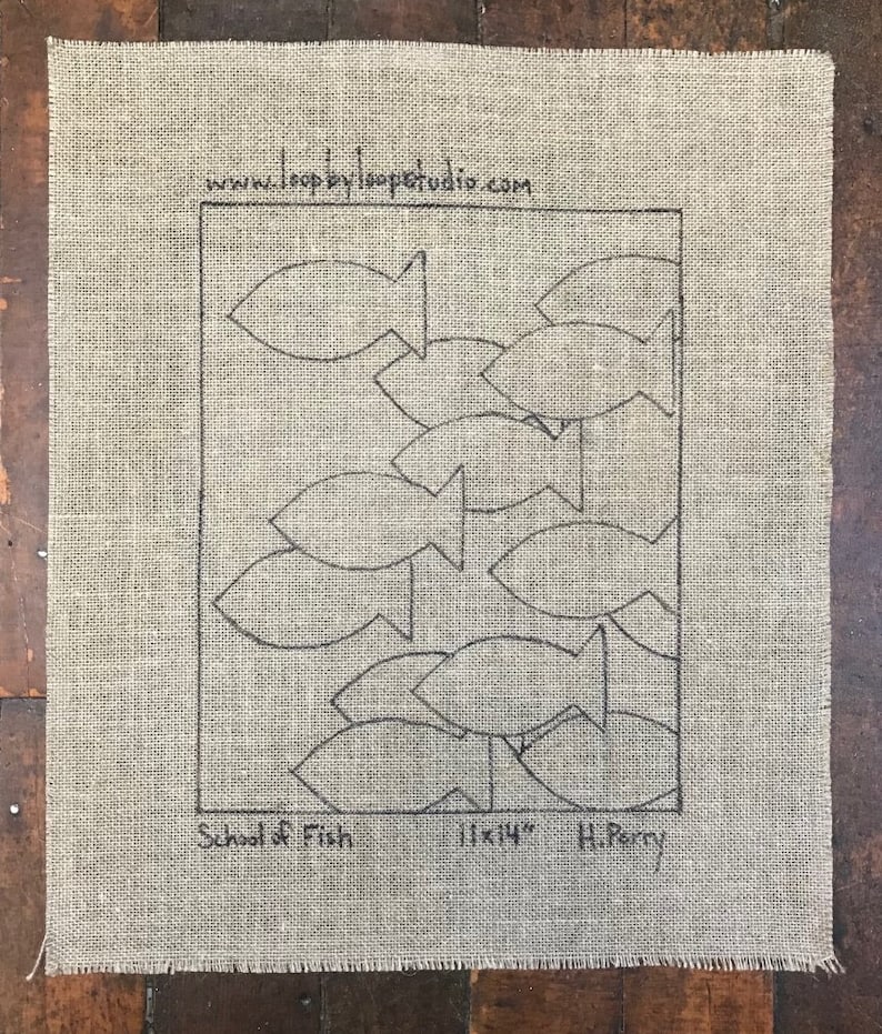 May include: A burlap fabric with a black outline of a school of fish. The fabric is 11x14 inches and is by H. Perry. The website www.loopbyloopstudio.com is printed on the fabric.