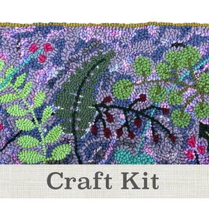 May include: A rectangular craft kit featuring a floral design with green, red, and purple elements. The background is a textured, light purple. The text "Craft Kit" is displayed on a white banner at the bottom.