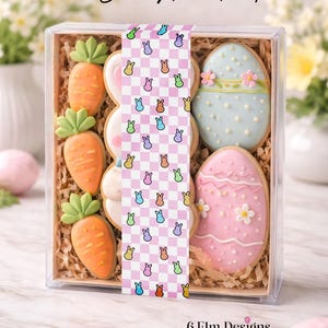 May include: A clear box filled with Easter-themed cookies. The cookies include carrot and egg shapes, decorated with icing. The box is sealed with a patterned strip that reads "Easter Bakery Seal Strips".