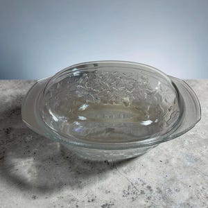 May include: A rustic wooden sign with the text "Welcome to our home" in white lettering. The sign features a distressed finish and a simple, inviting design, perfect for a front porch or entryway.