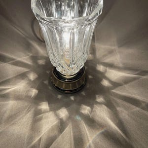 May include: A rustic wooden sign with the text "Welcome to our home" in white lettering. The sign features a distressed finish and a simple, inviting design, perfect for a front porch or entryway.