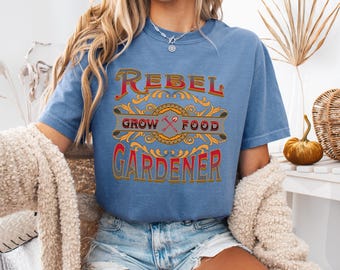 May include: A blue jean t-shirt with the text "Rebel Grow Food Gardener" in a vintage style font. The text is in red, yellow, and black.