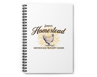 May include: White spiral notebook with a brown and white logo that says "Jennifer's Homestead" with a stylized image of a chicken and the text "Farm Fresh Eggs from Happy Chickens".
