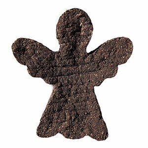 May include: A brown angel-shaped ornament made of pressed tea leaves.