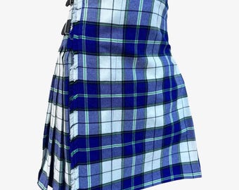 May include: A blue and white plaid kilt with a fringed edge. The kilt features a traditional design with pleats and adjustable leather straps with buckles. The fabric has a woven texture and a pattern of intersecting lines.