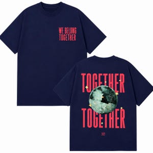 May include: Navy blue t-shirt with the text "WE BELONG TOGETHER" on the front. The back features the words "TOGETHER TOGETHER" with a disco ball graphic and the year 2023.