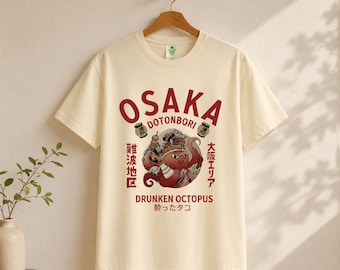 Esta camiseta vintage de Osaka Dotonbori presenta un divertido pulpo japonés en un estilo Harajuku de los años 90, de gran tamaño.