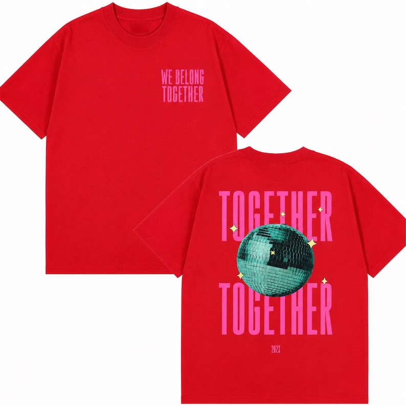 May include: Red t-shirt with the text "WE BELONG TOGETHER" in pink on the front. The back of the shirt features the words "TOGETHER" above and below a teal disco ball graphic, with the year "2023" below.