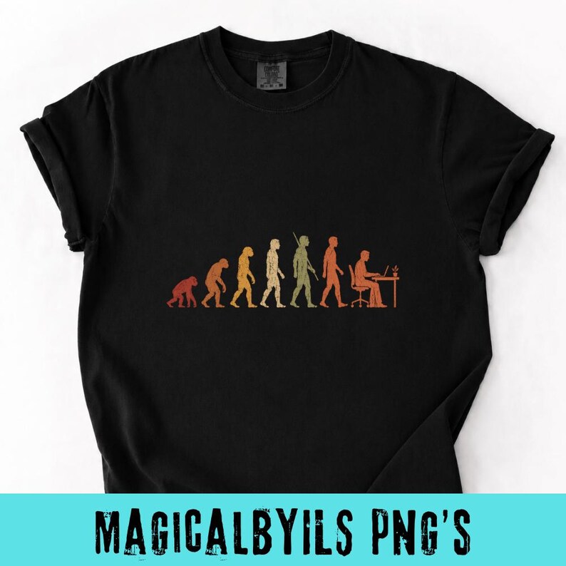 May include: A black short-sleeved t-shirt featuring a graphic print of human evolution in shades of orange and yellow. The design depicts the progression from a primate to a human sitting at a desk with a computer, arranged in a horizontal line.