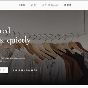 May include: A website landing page for Maison featuring a row of wooden hangers holding various garments. Text on the page reads: Fall / Winter Collection, Considered essentials, quietly made. A capsule of tailored outerwear, footwear, and accessories.