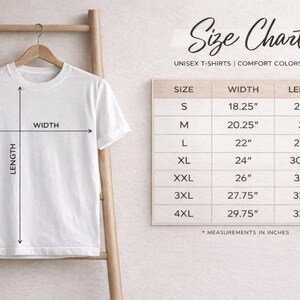 May include: A white t-shirt hanging on a wooden ladder with a size chart titled Size Chart Unisex T-Shirts Comfort Colors 1717. The chart lists sizes S through 4XL with corresponding width and length measurements in inches, ranging from 18.25 to 33.5 inches.