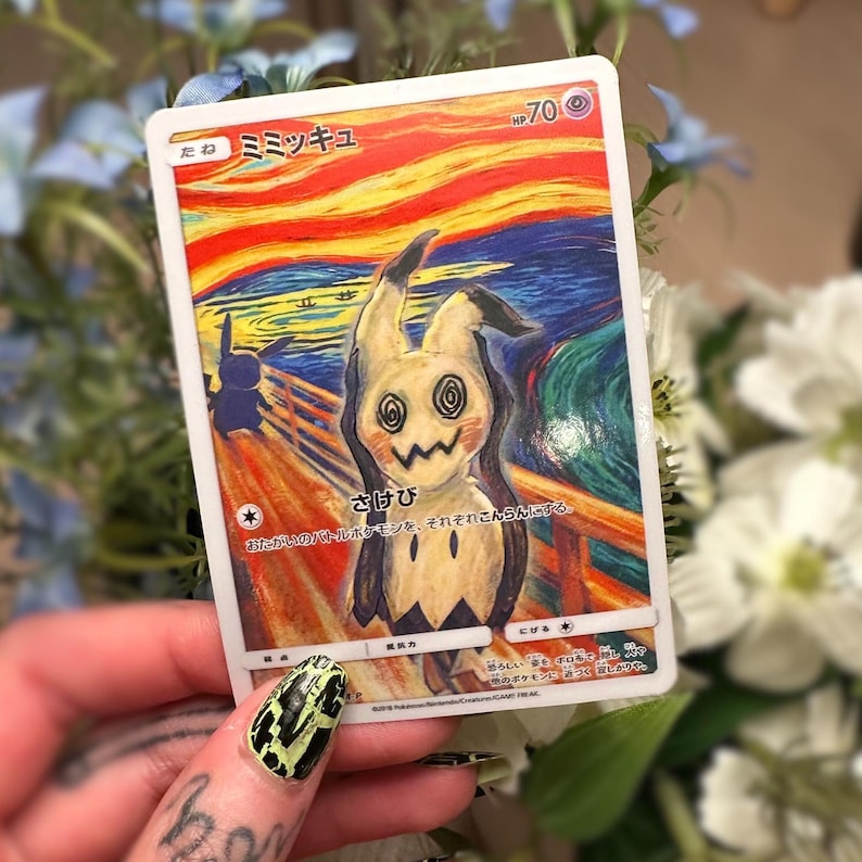 May include: A Mimikyu Pok&eacute;mon trading card with a distinctive artistic design. The card depicts a Mimikyu character in the style of Edvard Munch's "The Scream". The card includes Japanese text and a HP of 70.