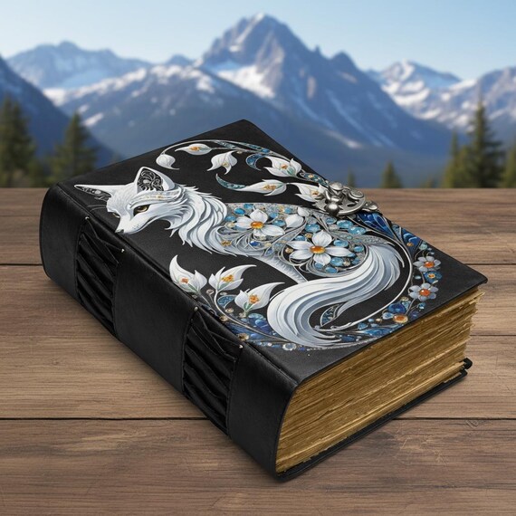 Fox-embossed leather journal with Art Nouveau floral cover design that doubles as a spellbook or Book of Shadows — genuinely atmospheric and visually striking.