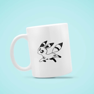 May include: White ceramic mug featuring a black and white cartoon character design. The character has large ears, a striped tail, and is depicted in a running pose. The mug has a curved handle and a smooth surface.