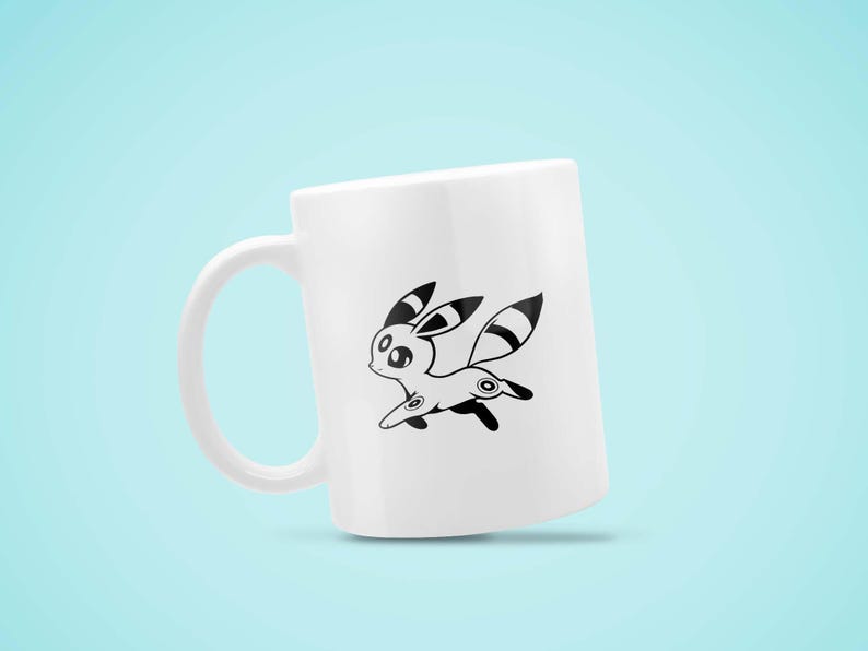 May include: White ceramic mug featuring a black and white cartoon character design. The character has large ears, a striped tail, and is depicted in a running pose. The mug has a curved handle and a smooth surface.