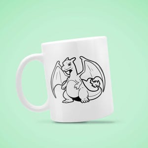 May include: White ceramic mug featuring a black and white illustration of a dragon with wings. The dragon is centered on the mug, with its wings spread. The mug has a curved handle and a smooth surface. The design is a cartoon style.