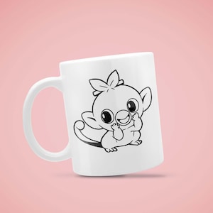 May include: White ceramic mug featuring a black and white cartoon illustration of a cute creature with large eyes and a playful expression. The mug has a curved handle and is set against a pink background.